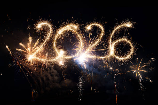 istock Sparkler Happy New Year 2026 with fireworks 2243824634