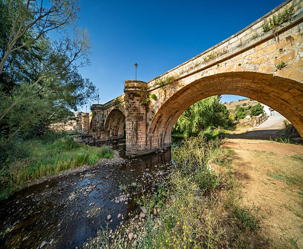 istock Medieval bridge over Arlanza river in Covarrubias, Spain 2243824936