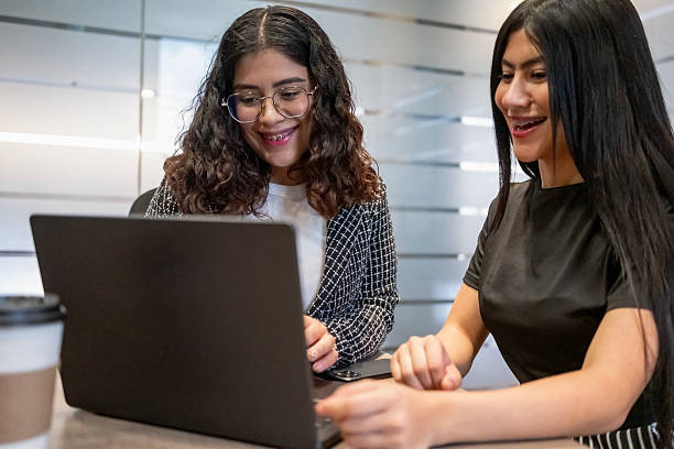 istock young female executives working happily and diligently in a modern office environment drinking coffee 2243828814