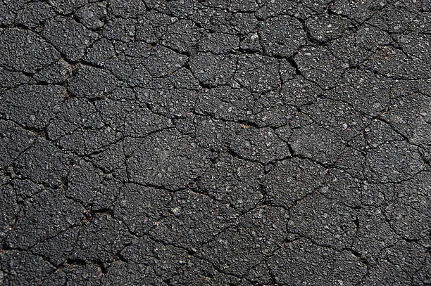 istock close up on crack on the asphalt ground 2243829592