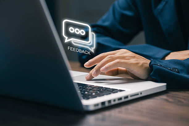istock A person typing on a laptop with a digital feedback bubble icon, symbolizing customer review, online response, and communication in business improvement systems. 2243829797