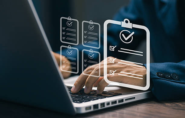 istock A businessman typing on a laptop with virtual digital checklist icons, representing task management, online form completion, and efficient workflow organization. 2243829802
