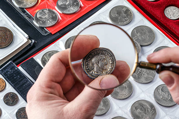 istock Numismatics.Authentic silver denarius, antoninianus of ancient Rome. A collector holds an old coin.Ancient coin of the Roman Empire.Magnifying glass 2243829947