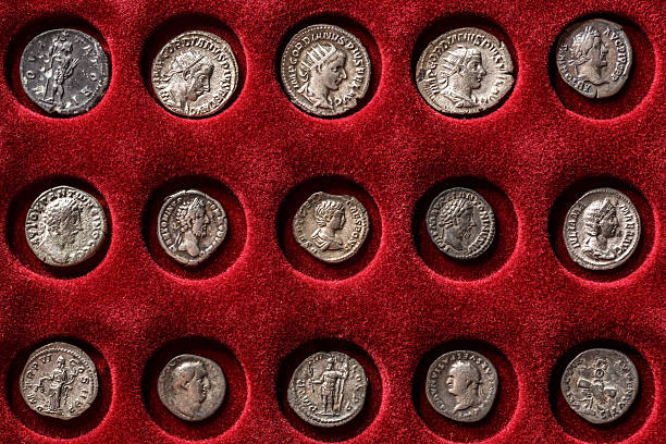 istock Numismatics.Authentic silver denarius, antoninianus of ancient Rome. A collector holds an old coin.Ancient coin of the Roman Empire.Magnifying glass 2243829985