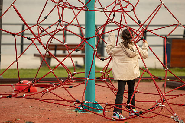 Little Girl Playing in Playground