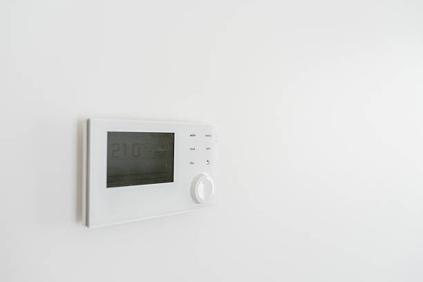 istock Modern Wall-Mounted Thermostat in a Minimalist Home Setting 2243830654