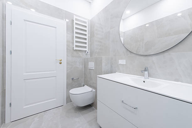 istock Modern White Bathroom Interior with Large Mirror and Clean Design 2243831234