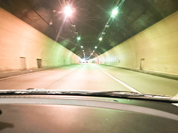 istock car tunnel on the road 2243833451