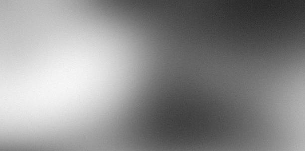 istock Noisy gradient gray white blurred grainy silver foil abstract monochrome background with blank space 2243833775