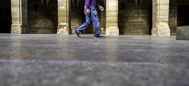 Detail of a man walking through the city, tourism