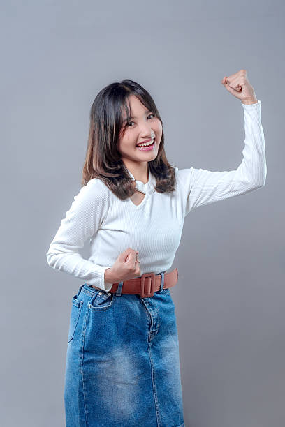 istock Confident Asian Woman Showing Strength and Positivity 2243839036