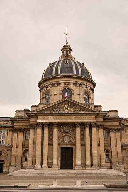 Institut de france, a neoclassical landmark building, stands against a cloudy sky