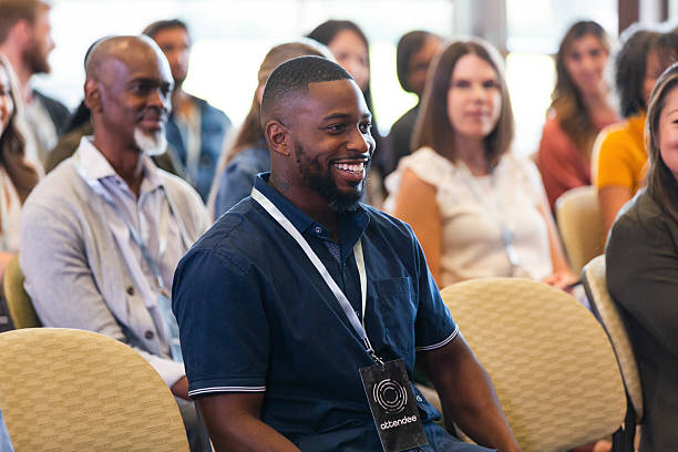 istock Smiling attendees listen attentively during a professional development or business meeting session. 2243841869