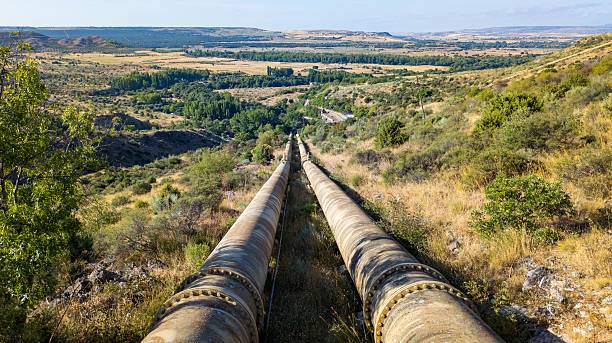 istock Pipelines through scenic rural landscape 2243842707