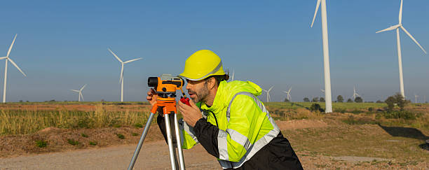 istock Survey Team Alternative energy for future. Engineers survey and checking wind turbines in sunset. Wind Turbine Renewable energy technology and sustainability. 2243842900