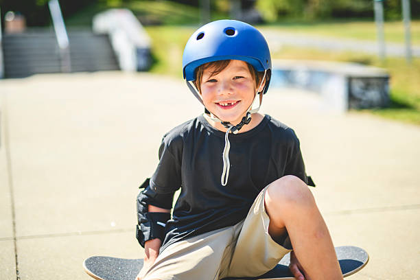 istock nice Boy with skateboards outside on skate playground 2243844464