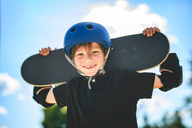 istock nice Boy with skateboards outside on skate playground 2243844465