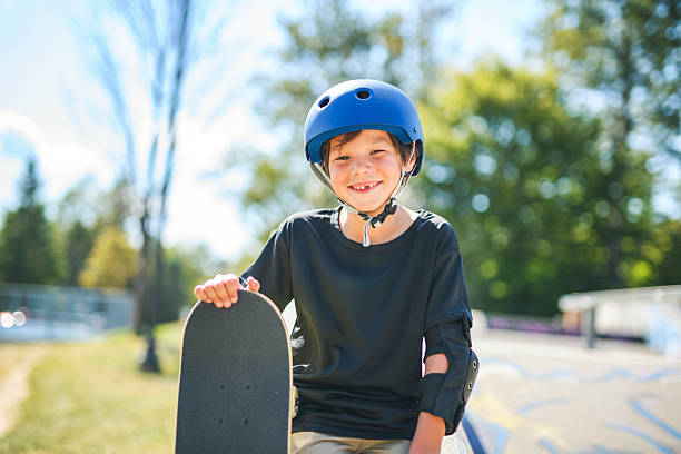 istock nice Boy with skateboards outside on skate playground 2243844468