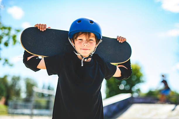 istock nice Boy with skateboards outside on skate playground 2243844476