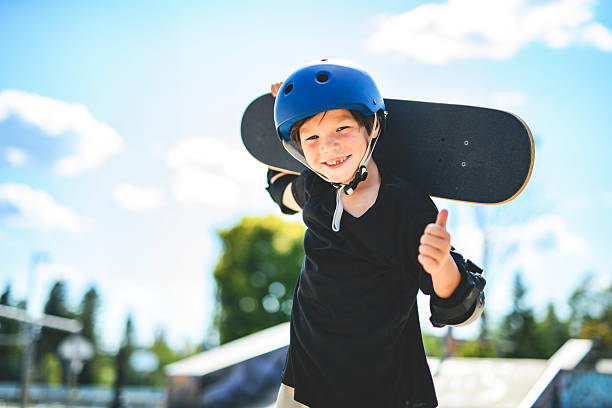 istock nice Boy with skateboards outside on skate playground 2243844486