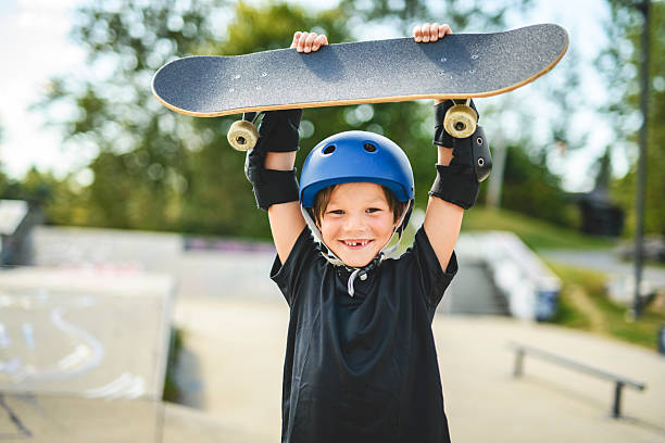 istock nice Boy with skateboards outside on skate playground 2243844500