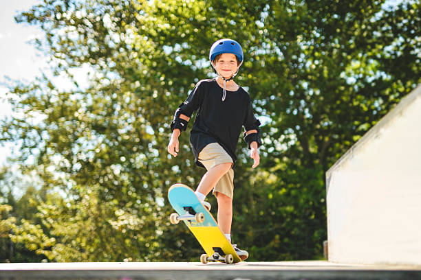 istock nice Boy with skateboards outside on skate playground 2243844502