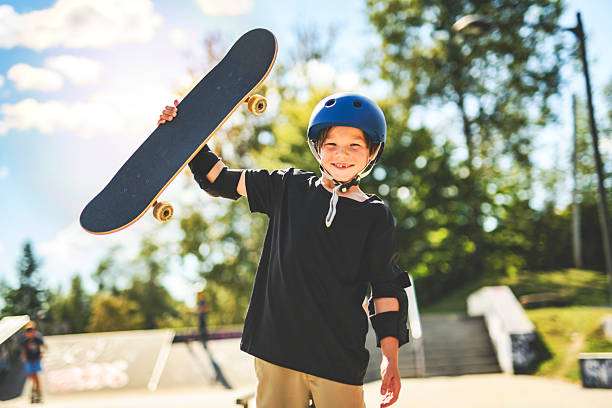 istock nice Boy with skateboards outside on skate playground 2243844504