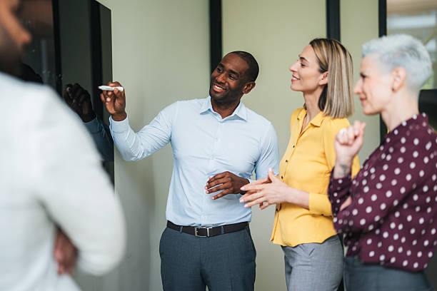 istock Group of colleagues having a brainstorming session at the office 2243845931