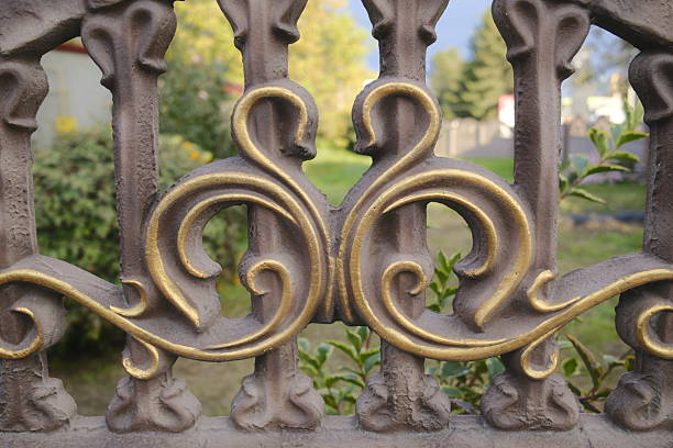 Metal fence with pins and ball.