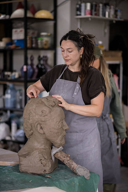 istock Woman potter working on detailed sculpture 2243846726