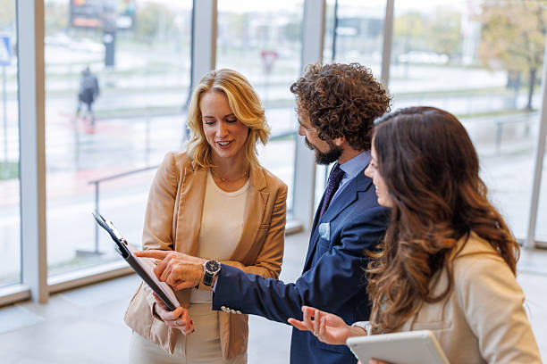 istock Business colleagues reviewing documents together in modern office 2243847848