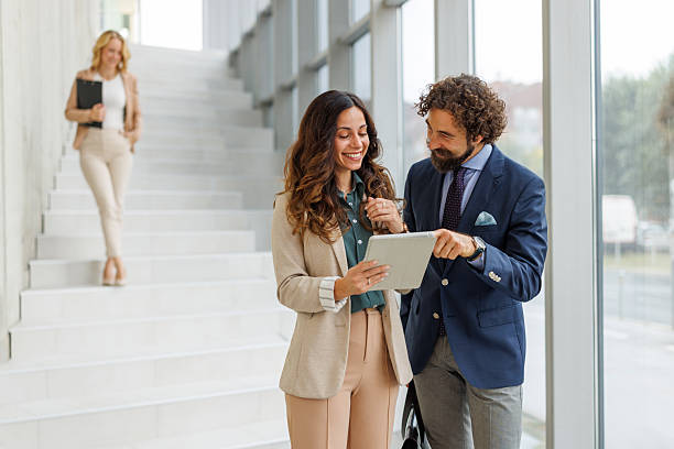 istock Business colleagues discussing data on digital tablet in modern office 2243847872