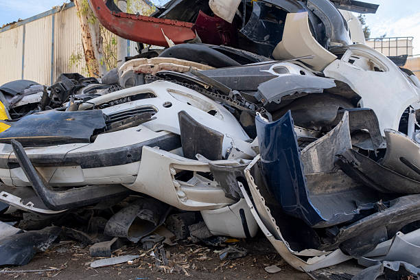 istock Old and damaged car bumpers collected for recycling. 2243848302