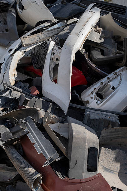 istock Old and damaged car bumpers collected for recycling. 2243848891