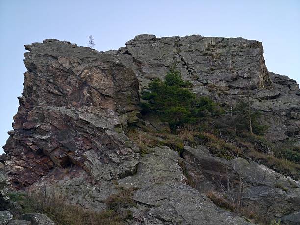 imposing vertical rock walls challenge daring explorers with scenic beauty and natural obstacles
