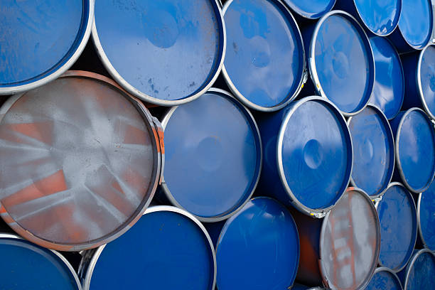 istock Blue and silver metal barrels arranged in rows. 2243850641