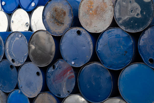 istock Blue and silver metal barrels arranged in rows. 2243851094
