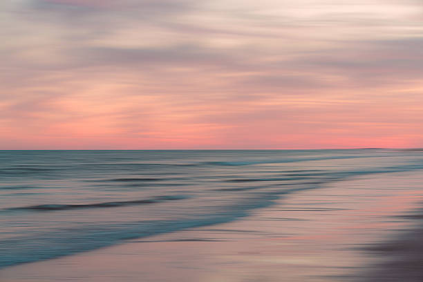 istock Dreamy seascape in pink evening light 2243851301