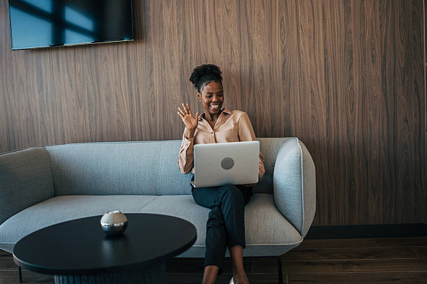 istock Businesswoman having video call, waving hello 2243855360