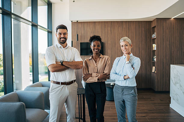 istock Diverse business team employees standing together in modern office 2243855598