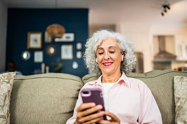 istock American senior woman using mobile phone at home 2243855758