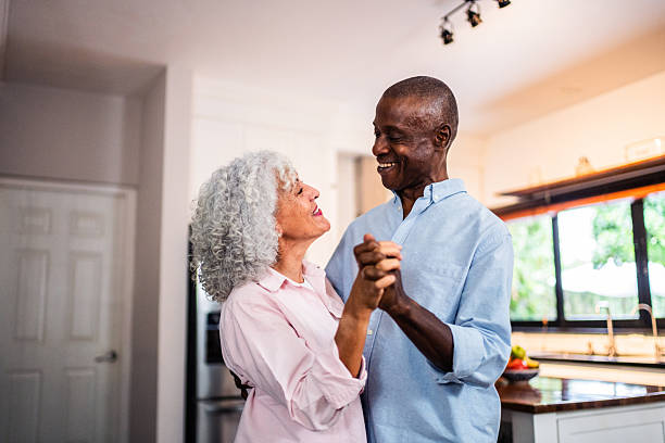 istock American senior couple dancing at home 2243856977