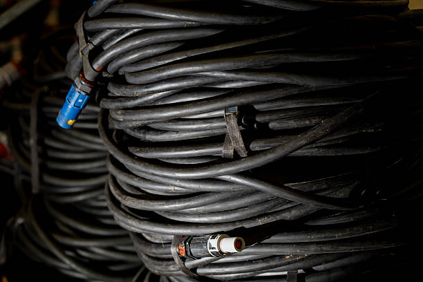 istock Coiled industrial power cables with connectors used for heavy-duty electrical connections and energy distribution in workshop or construction environments 2243857983