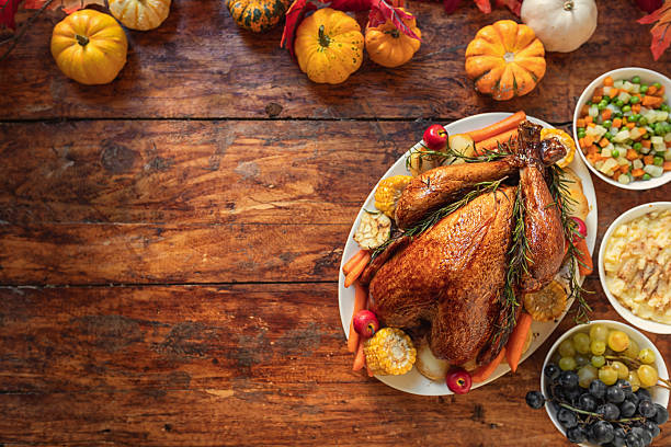 istock Preparing turkey with side dishes for Thanksgiving celebration 2243859193