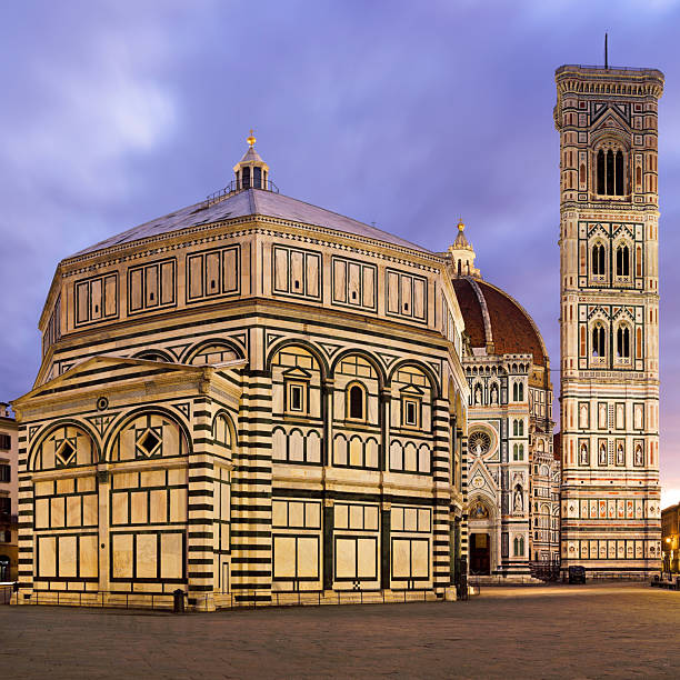 Twilight view of Piazza del Duomo in Florence, Italy, showing the Baptistery of St. John, Giotto’s Bell Tower, and the Cathedral of Santa Maria del Fiore. This UNESCO World Heritage site represents the height of Renaissance architecture and remains one of Tuscany’s most renowned landmarks.