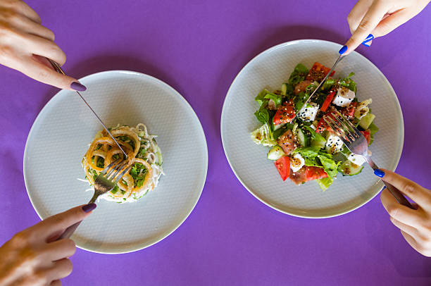 table with many salad top view. Different salads on concrete table, top view. Vegetable salad, Salad with smoked salmon, ceviche and stracciatella