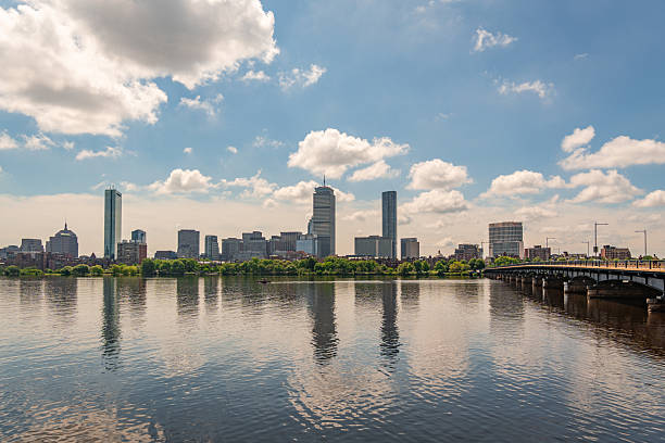 Cambridge, MA, US-July 15, 2025: View of the skyline of Boston from Cambridge with the Charles River  in foreground.