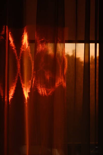 istock Sunlight Reflections on Sheer Curtains at Sunset 2243861469