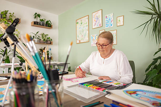istock Elderly Woman Enjoying Creative Work at Home 2243861817