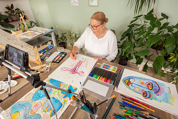 istock Elderly Woman Drawing in Relaxing Home Workspace 2243861953